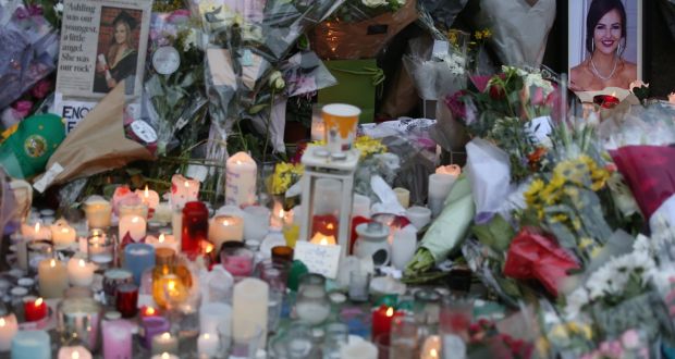 Flowers, messages and candles left at a memorial outside Leinster House for Ashling Murphy, who was murdered in Tullamore on Wednesday. Photograph: Stephen Collins/Collins Photos