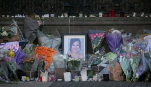 Flowers and messages outside Leinster House in Dublin in memory of Ashling Murphy. Photograph: Gareth Chaney/Collins