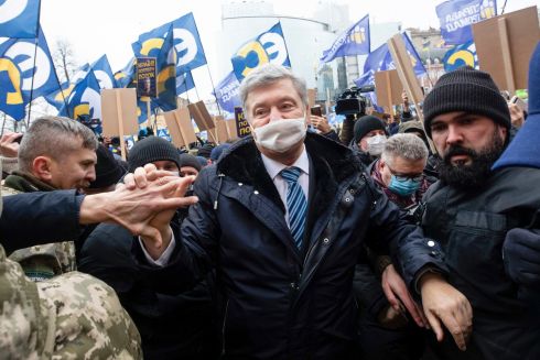 TREASON CHARGES: Former Ukrainian president Petro Poroshenko greets supporters as he arrives to attend a court session in Kyiv, Ukraine. Mr Poroshenko has returned to the country to face court on treason charges which he has said he believes are politically motivated. Photograph: Mikhail Palinchak/AP Photo
