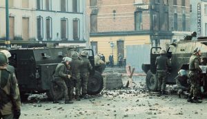 British soldiers stand behind an armoured water cannon and armoured cars as tensions rise on Bloody Sunday in Derry. Photograph: William L Rukeyser/Getty