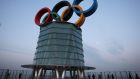 Visitors pose for photographs with the Olympic rings at the Beijing Olympic Tower on Sunday in Beijing, China. The Beijing 2022 Winter Olympics are set to open on February 4th. Photograph: Lintao Zhang/Getty Images