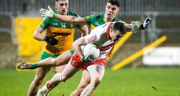 Derry’s Gareth McKinless is challenged vy  Odhrán McFadden Ferry of Donegal during the Bank of Ireland Dr McKenna Cup semi-final at  Seán MacCumhaill Park in  Ballybofey. Photograph: Evan Logan/Inpho 