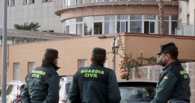 Civil Guard’s officers stand guard outside an old people’s home the morning after a fire started in the facilities, in the town of Moncada, Valencia. Photograph: Kai Foersterling/EPA