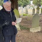 Tomi Reichental and his wife Joyce at the grave of Ludwig Hopf in Mount Jerome cemetery in Dublin