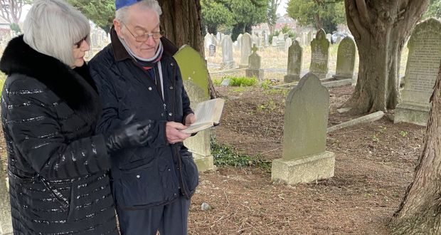 Tomi Reichental and his wife Joyce at the grave of Ludwig Hopf in Mount Jerome cemetery in Dublin