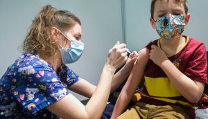 A six-year-old boy receives the first jab of the Pfizer Covid-19 vaccine in Namur, Belgium, on Thursday. Photograph: Olivier Hoslet/EPA