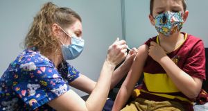 A six-year-old boy receives the first jab of the Pfizer Covid-19 vaccine in Namur, Belgium, on Thursday. Photograph: Olivier Hoslet/EPA