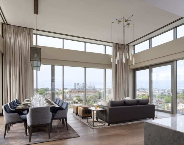 The double-height living & dining room in one of the penthouses at Lansdowne Place, Ballsbridge, Dublin 4
