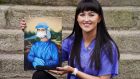 Trainee nurse Chloe Slevin with her painting Corona Lisa, showing Leonardo Da Vinci’s Mona Lisa dressed in full PPE. Photograph: Brian Lawless/PA