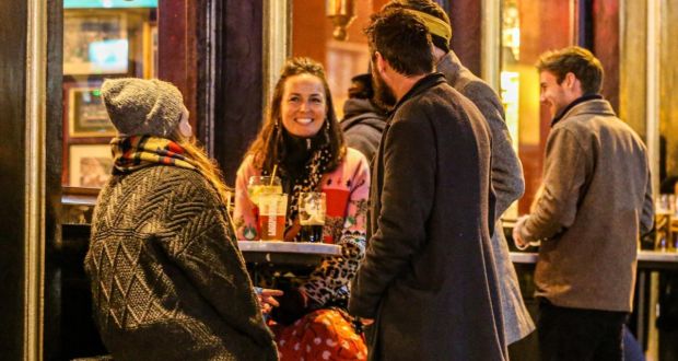 Socialising in Temple Bar following the easing of Covid-19 restrictions: The Taoiseach pulled a rabbit from a hat, and in a puff of smoke, the pandemic was gone. In reality, that’s not exactly the case. Photograph: Damien Storan/PA 