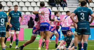 Stade Francais’  Kylan Hamdaoui is congratulated after he runs in a try. Photograph: Dave Winter/Inpho