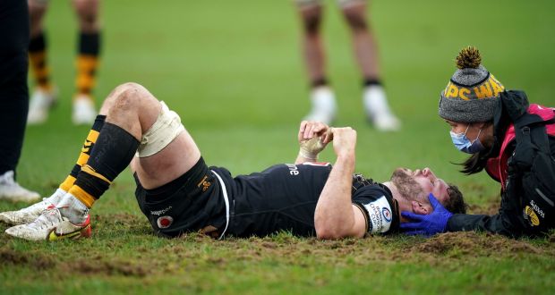 Wasps’ Thomas Young is treated for an injury during the Heineken Champions Cup Pool A match against Munster  at Thomond Park. The flanker was discharged from University Hospital Limerick on Monday. Photograph: Niall Carson/PA Wire