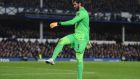 Liverpool goalkeeper Alisson Becker kicks a bottle off of the pitch during the Premier League match against  Everton  at Goodison Park in December. Photograph:   Laurence Griffiths/Getty Images