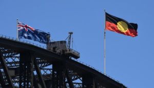 The Australian government has acquired copyright of the Aboriginal flag so it can be freely used as a symbol of indigenous unity and pride. Photograph: Getty