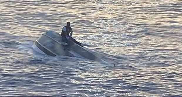 The man who was rescued after he was found straddling the hull of a boat that capsized near the Fort Pierce Inlet on Florida’s Atlantic Coast. Photograph: US Embassy Nassau via The New York Times