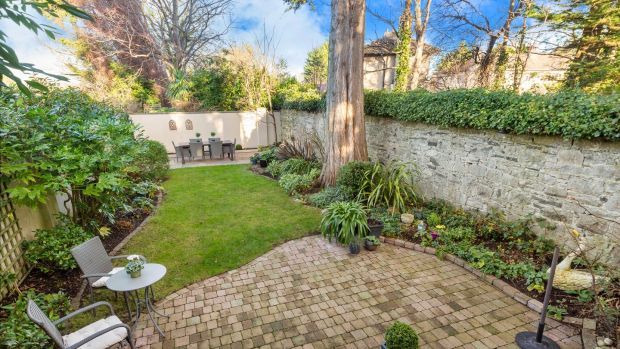 Garden with original granite boundary wall and patios at each end