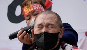 A Covid-19 protest by business owners, South Korea-style. Photograph: Ahn Young-joon/AP