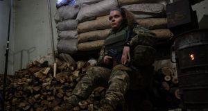 Ukrainian soldier Anastasia (21) rests in a shelter near Avdiivka in the Donetsk Oblast  on Wednesday. Photograph: Stas Kozlyuk/EPA