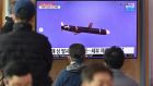A news broadcast with file footage of a North Korean missile test. North Korea fired what appeared to be two short-range ballistic missiles on Thursday. Photograph: Jung Yeon-je/AFP via Getty Images