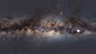  The Milky Way as viewed from Earth, with a star icon (at R-placed by source) marking the position of a mysterious repeating transient in space. Photograph: Natasha Hurley-Walker/International Centre for Radio A/AFP