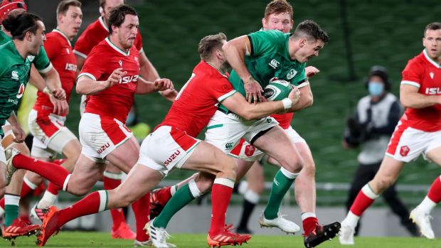 Ireland’s Johnny Sexton is tackled by Wales’s Dan Biggar. Photograph: Dan Sheridan/Inpho