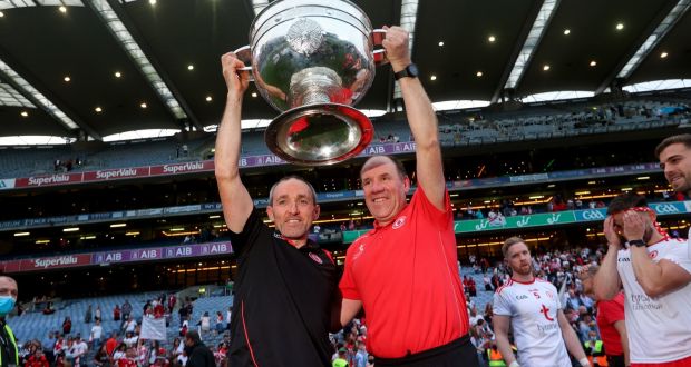 Joint managers Brian Dooher and Feargal Logan lift the Sam Maguire after Tyrone’s All-Ireland final win over Mayo. ‘It was good and it brought great joy to the place. But overall, it was busy, busy. Good busy. Happy busy,’ says Logan. Photograph: Ryan Byrne/Inpho