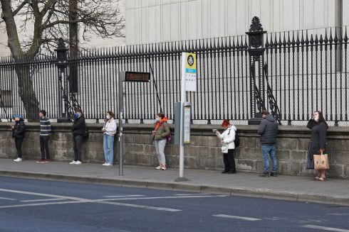 PUBLIC SPACE: Members of the public form an orderly socially-distanced queue for the bus on Dublin’s Nassau Street. Photograph: Nick Bradshaw


