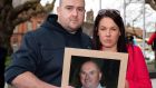Robert and Michelle Ryan, with a photo of their father, Bobby Ryan, outside court after Patrick Quirke was convicted in 2019. Photograph: Collins Courts