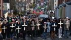 Families of victims and their supporters take part in a Bloody Sunday memorial march: ‘We will not go away and we will not be silenced.’ Photograph: Getty