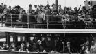 Passengers wave farewell to friends on the quayside in Galway harbour. Photograph: Hulton-Deutsch Collection/Corbis via Getty