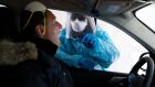  A PCR test for Covid-19 is administered at a drive-thru testing site in Baltimore, Maryland, US on January 26th. Photograph: Michael Reynolds/EPA