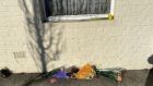 Flowers outside the house where the decomposed remains of a man were found in Sallynoggin, Co Dublin. Photograph: Tim O’Brien