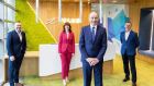 Tony Barry, vice-president  of finance; Miriam Manning, HR director;  Taoiseach Micheál Martin; and Roger Clancy, vice-president  of operations and general manager, at Telus’s Irish headquarters in Cork. Photograph: Michael O’Sullivan/OSM PHOTO 