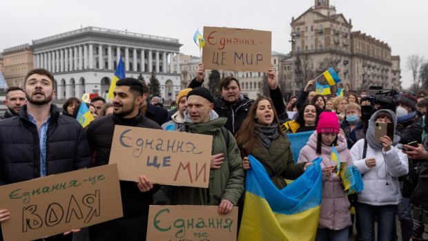 People sing the Ukrainian national anthem in front of Independence monument to mark the newly-created “unity day” on Wednesday in Kyiv. Photograph: Chris McGrath/Getty Images