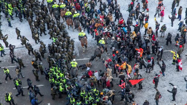 Police officers begin to make arrests at the trucker-led protest in Ottawa, Canada, Friday, February 18th, 2022. Photograph: Brett Gundlock/The New York Times