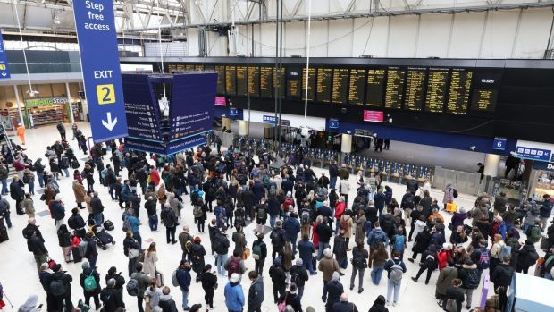 Passengers wait at Waterloo station, London, for cancelled or delayed trains in the aftermath of Storm Eunice on Friday. Photograph: James Manning/PA Wire