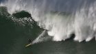 BEAUTY AND THE BEAST: A surfer competes in the Punta Galea Challenge, an international big wave surfing competition, near the northern Spanish city of Getxo. The challenge is the oldest big wave surfing competition in Europe. Photograph: Ander Gillenea/AFP/Getty

