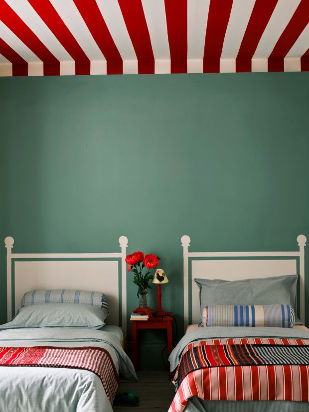 Embrace your inner creativity by using paint to create effects, such as the painted headboards and roof effect seen here by Farrow & Ball