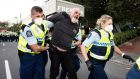 A man is arrested as police and protesters clash in Wellington, New Zealand. Photograph: George Heard/New Zealand Herald via AP