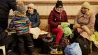 People take shelter from bombings in an underground station  in Kyiv, Ukraine, on Friday. Photograph: Pierre Crom/Getty Images
