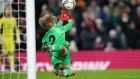 Liverpool goalkeeper Caoimhín Kelleher makes a save during the penalty shoot-out against Leicester City. Photograph: Mike Egerton/PA Wire