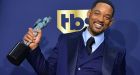 Will Smith poses with his SAG award. Photograph: Frederic J Brown/AFP via Getty