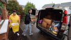 Kasia and Daniel Kuty load a van with donations from the public for distribution to the people of Ukraine. Photograph: Dara Mac Dónaill 