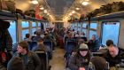 A carriage on the train from Przemysl, Poland, to Lviv, Ukraine, late on Friday: ‘The moment the war started, I knew I had to come back,’ said one man. Photograph: Lara Marlowe