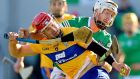 Clare’s John Conlon breaks his hurl as he is tackled by Cian Lynch of Limerick. Photograph: James Crombie/Inpho
