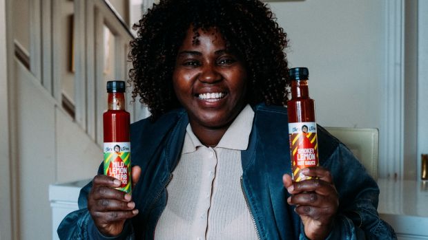 Ellie Kisyombe with the African-inspired Irish hot sauces she makes, with a percentage of the proceeds going to Our Table.