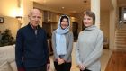 Róisín Connolly and Martin Hawkes with Sakina, an Afghan refugee who is staying with them at the moment. Photograph: Nick Bradshaw