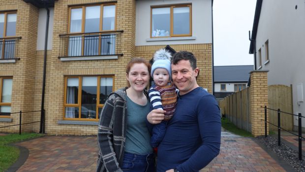Colm and Jane Ward with their baby Darragh outside their new home in Drogheda, Co Louth. ‘We didn’t go on holidays, we didn’t have a lot of luxuries, we put our head down and worked,’ says the couple. Photograph: Dara Mac Dónaill