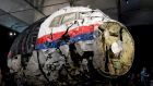 The reconstructed wreckage of  Flight MH17 on display during a press conference in the  Netherlands. Photograph:  Peter Dejong/AP Photo