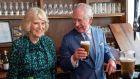 Prince Charles, with his wife Camilla,   takes a drink of a  pint of Guinness he pulled at the Irish Cultural Centre in London. Photograph: Arthur Edwards/Pool/AFP via Getty
